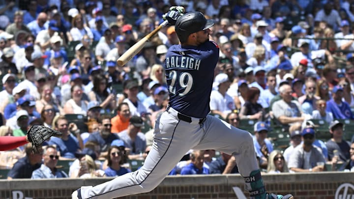 Seattle Mariners catcher Cal Raleigh hits a home run during a game against the Chicago Cubs at June 20 at Wrigley Field. Seattle Mariners catcher Cal Raleigh hits a home run during a game against the Chicago Cubs at June 20 at Wrigley Field.