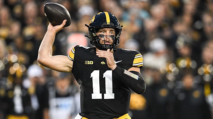 Oct 18, 2025; Iowa City, Iowa, USA; Iowa Hawkeyes quarterback Mark Gronowski (11) throws a pass against the Penn State Nittany Lions during the first quarter at Kinnick Stadium. Mandatory Credit: Jeffrey Becker-Imagn Images Oct 18, 2025; Iowa City, Iowa, USA; Iowa Hawkeyes quarterback Mark Gronowski (11) throws a pass against the Penn State Nittany Lions during the first quarter at Kinnick Stadium. Mandatory Credit: Jeffrey Becker-Imagn Images