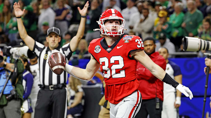 Jan 2, 2025; New Orleans, LA, USA; Georgia Bulldogs running back Cash Jones (32) celebrates after scoring a touchdown during the second half against the Notre Dame Fighting Irish at Caesars Superdome. Mandatory Credit: Amber Searls-Imagn Images