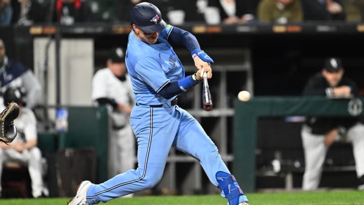 May 28, 2024; Chicago, Illinois, USA;  Toronto Blue Jays catcher Danny Jansen (9) hits a single in the fifth inning against the Chicago White Sox at Guaranteed Rate Field.