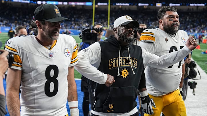 Pittsburgh Steelers Pittsburgh Steelers head coach Mike Tomlin, center, next to quarterback Aaron Rodgers (8) and defensive tackle Keeanu Benton (95) walk off the field after 29-24 win over Detroit Lions at Ford Field in Detroit on Sunday, Dec. 21, 2025.