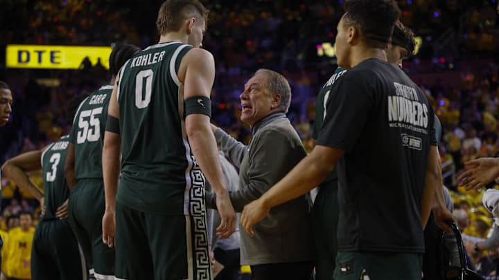 Feb 21, 2025; Ann Arbor, Michigan, USA; Michigan State Spartans head coach Tom Izzo talks with Michigan State Spartans forward Jaxon Kohler (0) during the first half of the game against the Michigan Wolverines at Crisler Center. Mandatory Credit: Brian Bradshaw Sevald-Imagn Images