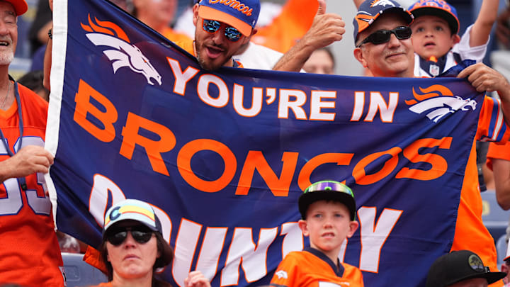 Aug 25, 2024; Denver, Colorado, USA; Denver Broncos fans cheer in the froth quarter against the Arizona Cardinals at Empower Field at Mile High. Mandatory Credit: Ron Chenoy-Imagn Images