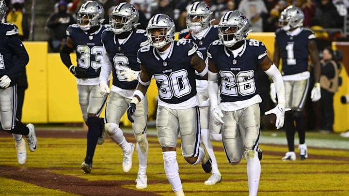 Dallas Cowboys cornerback DaRon Bland celebrates after intercepting a pass against the Washington Commanders during the second half at FedEx Field.