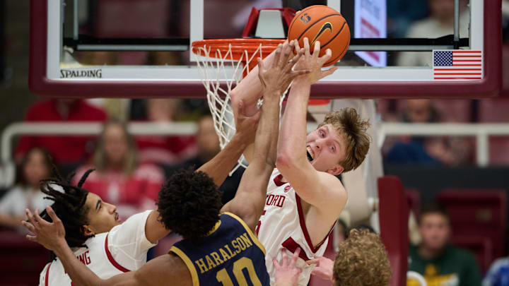 Dec 30, 2025; Stanford, California, USA; Stanford Cardinal center Oskar Giltay (15) vies for a rebound against Notre Dame Fighting Irish guard Jalen Haralson (10) during the second half at Maples Pavilion. Mandatory Credit: Robert Edwards-Imagn Images
