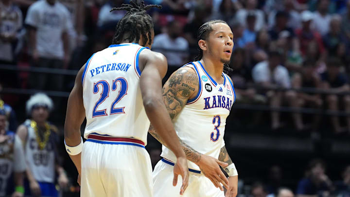 Mar 20, 2026; San Diego, CA, USA; Kansas Jayhawks guard Tre White (3) and guard Darryn Peterson (22) react in the first half against the California Baptist Lancers during a first round game of the men's 2026 NCAA Tournament at Viejas Arena. Mandatory Credit: Kirby Lee-Imagn Images Mar 20, 2026; San Diego, CA, USA; Kansas Jayhawks guard Tre White (3) and guard Darryn Peterson (22) react in the first half against the California Baptist Lancers during a first round game of the men's 2026 NCAA Tournament at Viejas Arena. Mandatory Credit: Kirby Lee-Imagn Images
