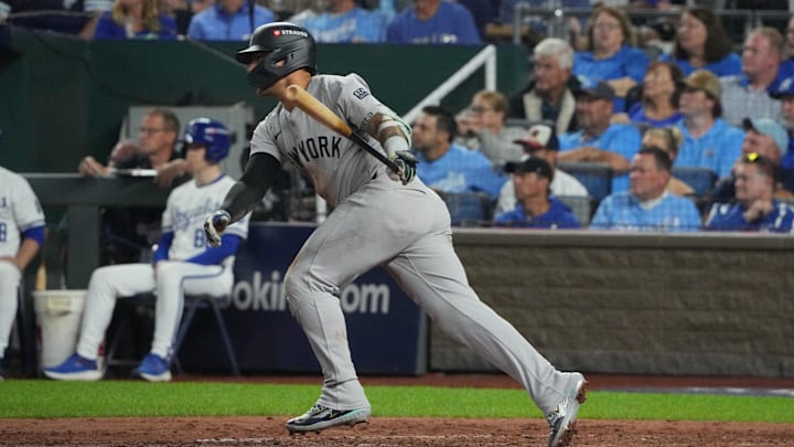 Oct 10, 2024; Kansas City, Missouri, USA; New York Yankees second baseman Gleyber Torres (25) hits an RBI single during the fifth inning against the Kansas City Royals during game four of the ALDS for the 2024 MLB Playoffs at Kauffman Stadium.