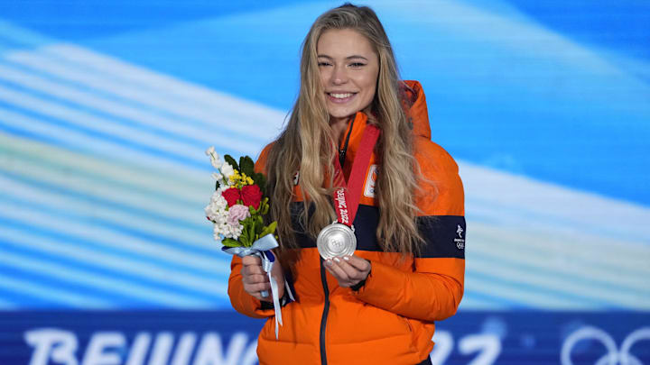 Silver medalist Jutta Leerdam celebrates during the medals ceremony for women's 1000m speed skating event at the Beijing 2022 Olympic Winter Games. Silver medalist Jutta Leerdam celebrates during the medals ceremony for women's 1000m speed skating event at the Beijing 2022 Olympic Winter Games.