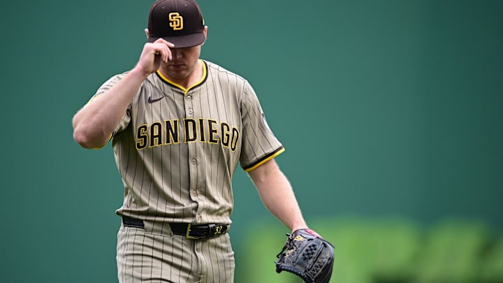 May 4, 2025; Pittsburgh, Pennsylvania, USA; San Diego Padres starting pitcher Stephen Kolek (32) tips his hat while walking to the dugout after a double play during the fourth inning against the Pittsburgh Pirates at PNC Park. Mandatory Credit: David Dermer-Imagn Images