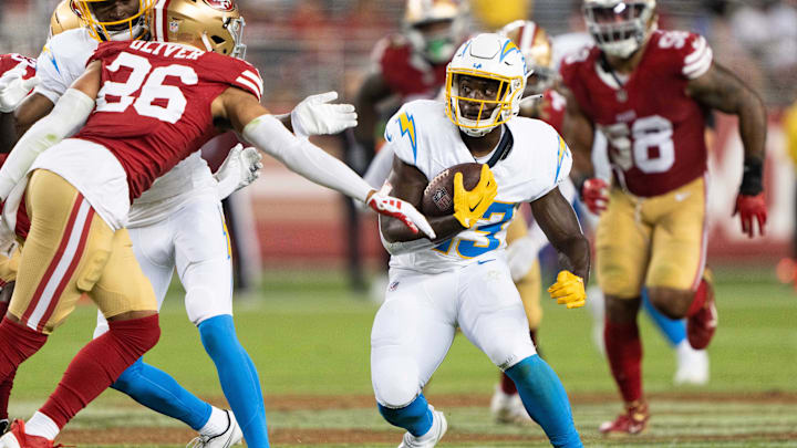 Aug 25, 2023; Santa Clara, California, USA; Los Angeles Chargers running back Aaron Shampklin (23) runs with the football during the fourth quarter against San Francisco 49ers cornerback Isaiah Oliver (26) at Levi's Stadium. Mandatory Credit: Stan Szeto-Imagn Images