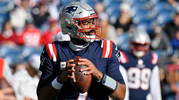 Nov 17, 2024; Foxborough, Massachusetts, USA;  New England Patriots quarterback Jacoby Brissett (7) warms up before a game against the Los Angeles Rams at Gillette Stadium. Mandatory Credit: Eric Canha-Imagn Images