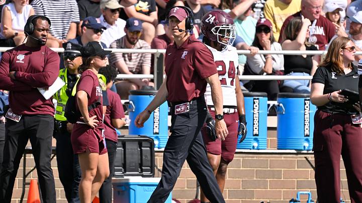 Fordham Rams head coach Joe Conlin walks the sideline during the first half against the Boston College Eagles