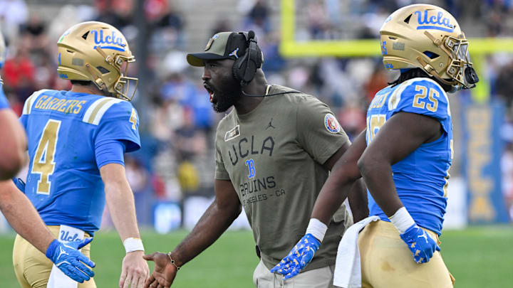 Nov 30, 2024; Pasadena, California, USA; UCLA Bruins head coach DeShaun Foster greets quarterback Ethan Garbers (4) during the third quarter against the Fresno State Bulldogs at Rose Bowl. Mandatory Credit: Robert Hanashiro-Imagn Images Nov 30, 2024; Pasadena, California, USA; UCLA Bruins head coach DeShaun Foster greets quarterback Ethan Garbers (4) during the third quarter against the Fresno State Bulldogs at Rose Bowl. Mandatory Credit: Robert Hanashiro-Imagn Images