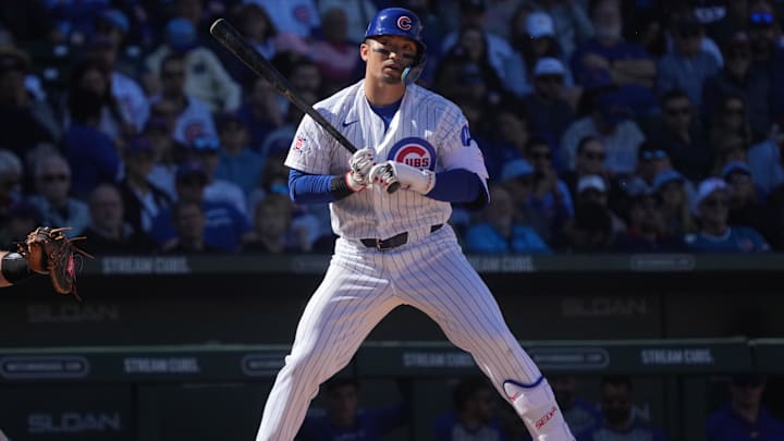 Feb 20, 2026; Mesa, Arizona, USA; Chicago Cubs right fielder Seiya Suzuki (27) reacts after missing a pitch against the Chicago White Sox in the third inning at Sloan Park. Mandatory Credit: Rick Scuteri-Imagn Images