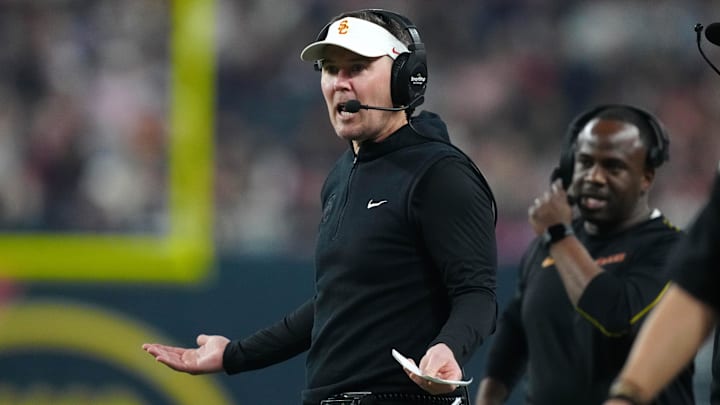 Dec 27, 2024; Las Vegas, NV, USA; Southern California Trojans head coach Lincoln Riley reacts against the Texas A&M Aggies in the first half at Allegiant Stadium. Mandatory Credit: Kirby Lee-Imagn Images