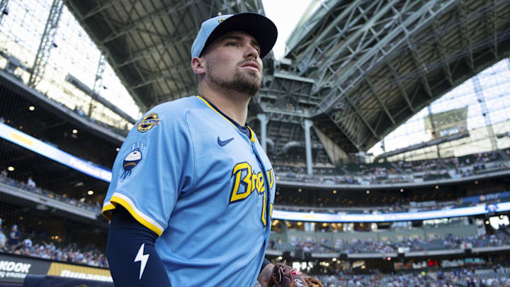Jun 27, 2025; Milwaukee, Wisconsin, USA;  Milwaukee Brewers third baseman Caleb Durbin (21) jogs onto the field during warmups prior to the game against the Colorado Rockies at American Family Field. Mandatory Credit: Jeff Hanisch-Imagn Images