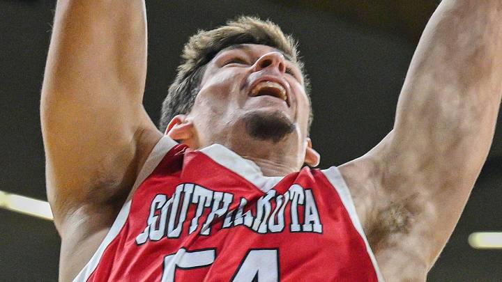 Nov 12, 2024; Iowa City, Iowa, USA; South Dakota Coyotes center Cameron Fens (54) shoots against Iowa Hawkeyes forward Even Brauns (0) during the first half at Carver-Hawkeye Arena. Mandatory Credit: Jeffrey Becker-Imagn Images Nov 12, 2024; Iowa City, Iowa, USA; South Dakota Coyotes center Cameron Fens (54) shoots against Iowa Hawkeyes forward Even Brauns (0) during the first half at Carver-Hawkeye Arena. Mandatory Credit: Jeffrey Becker-Imagn Images