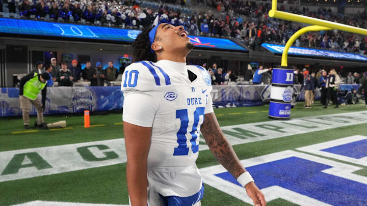 Dec 6, 2025; Charlotte, NC, USA; Duke Blue Devils quarterback Darian Mensah (10) reacts after winning the  ACC Championship game at Bank of America Stadium. Mandatory Credit: Bob Donnan-Imagn Images