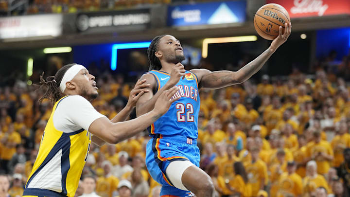 Jun 13, 2025; Indianapolis, Indiana, USA; Oklahoma City Thunder guard Cason Wallace (22) shoots the ball against Indiana Pacers center Myles Turner (33) during the first half during game four of the 2025 NBA Finals at Gainbridge Fieldhouse. Mandatory Credit: Kyle Terada-Imagn Images