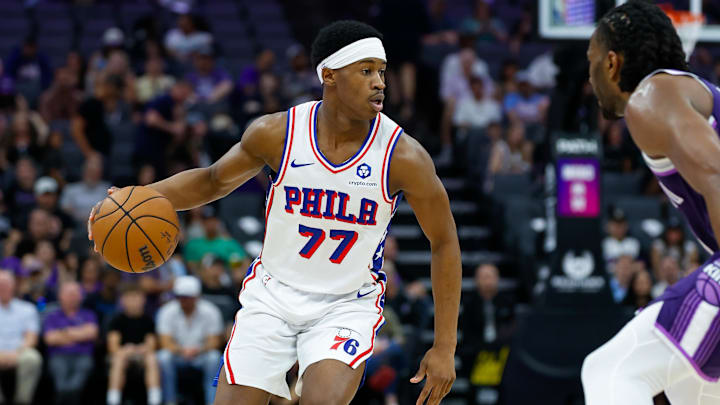 Mar 19, 2026; Sacramento, California, USA; Philadelphia 76ers guard Vj Edgecombe (77) dribbles the ball against Sacramento Kings forward Precious Achiuwa (9) during the second quarter at Golden 1 Center. Mandatory Credit: Sergio Estrada-Imagn Images