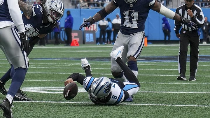 Dec 15, 2024; Charlotte, North Carolina, USA; Carolina Panthers quarterback Bryce Young (9) loses a fumble during a drive against the Dallas Cowboys during the first quarter at Bank of America Stadium. Mandatory Credit: Jim Dedmon-Imagn Images