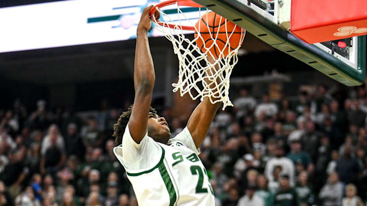 Michigan State's Jase Richardson wears his father Jason's jersey while slamming the ball during the dunk contest during the Michigan State Madness event on Friday, Oct. 4, 2024, at the Breslin Center in East Lansing.