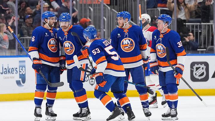 Apr 12, 2026; Elmont, New York, USA; New York Islanders center Casey Cizikas (53) celebrates a goal with defenseman Ryan Pulock (6), defenseman Scott Mayfield (24), center Marc Gatcomb (16) and center Kyle MacLean (32) against the Montreal Canadiens in the third period at UBS Arena. Mandatory Credit: Alexander Wohl-Imagn Images