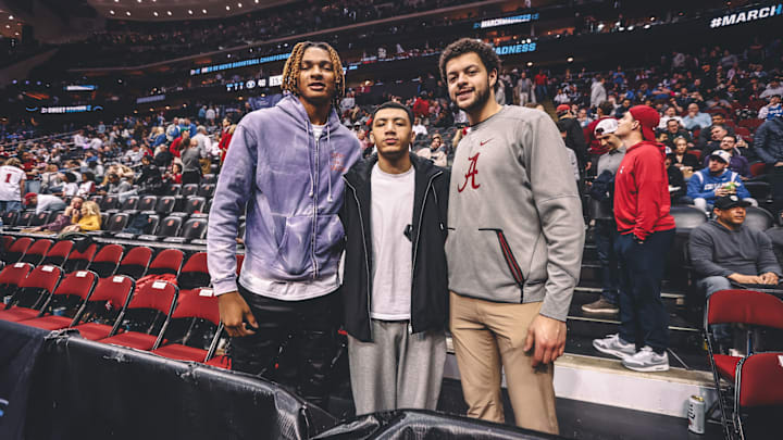 Former Alabama basketball players attend the Crimson Tide's Sweet 16 game against BYU.