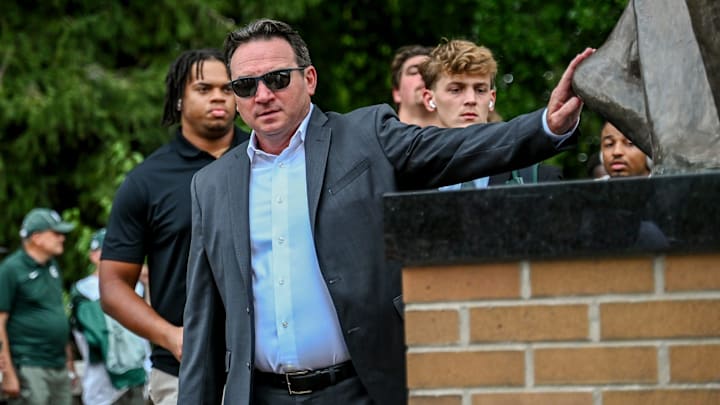 Michigan State's head coach Jonathan Smith touches the foot of the Sparty statue before the game against Florida Atlantic on Friday, Aug. 30, 2024, outside Spartan Stadium in East Lansing. Michigan State's head coach Jonathan Smith touches the foot of the Sparty statue before the game against Florida Atlantic on Friday, Aug. 30, 2024, outside Spartan Stadium in East Lansing.