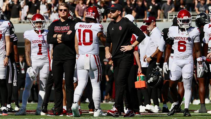 Oklahoma offensive coordinator Ben Arbuckle looks on as the Sooners warm up ahead of their contest with Mississippi State. Oklahoma offensive coordinator Ben Arbuckle looks on as the Sooners warm up ahead of their contest with Mississippi State.