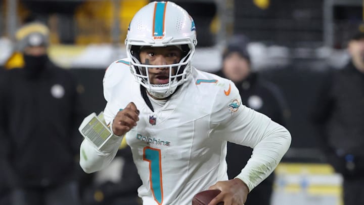 Miami Dolphins quarterback Tua Tagovailoa (1) runs out of the pocket in the fourth quarter against the Pittsburgh Steelers at Acrisure Stadium last December.