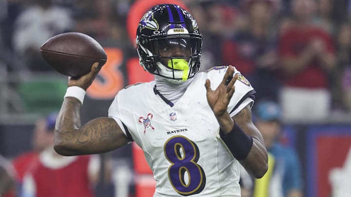 Dec 25, 2024; Houston, Texas, USA;  Baltimore Ravens quarterback Lamar Jackson (8) attempts a pass during the fourth quarter against the Houston Texans at NRG Stadium. Mandatory Credit: Troy Taormina-Imagn Images
