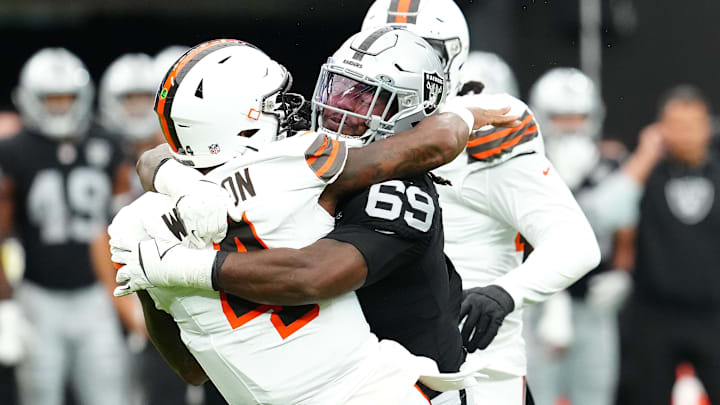 Sep 29, 2024; Paradise, Nevada, USA; Las Vegas Raiders defensive tackle Adam Butler (69) tackles Cleveland Browns quarterback Deshaun Watson (4) during the first quarter at Allegiant Stadium. Mandatory Credit: Stephen R. Sylvanie-Imagn Images Sep 29, 2024; Paradise, Nevada, USA; Las Vegas Raiders defensive tackle Adam Butler (69) tackles Cleveland Browns quarterback Deshaun Watson (4) during the first quarter at Allegiant Stadium. Mandatory Credit: Stephen R. Sylvanie-Imagn Images