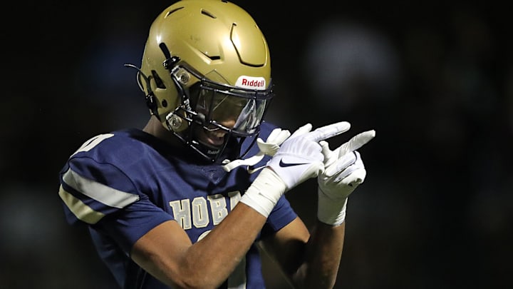 Hoban wide receiver Elbert Hill IV acknowledges the crowd after his touchdown against Walsh Jesuit