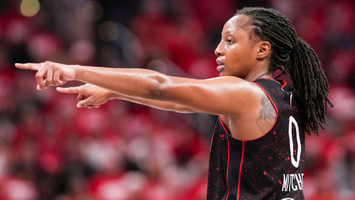 Indiana Fever guard Kelsey Mitchell (0) points to her teammates Tuesday, Sept. 16, 2025, during Game 2 of a WNBA playoff matchup between the Indiana Fever and the Atlanta Dream at Gainbridge Fieldhouse in Indianapolis. The Indiana Fever defeated the Atlanta Dream, 77-60.