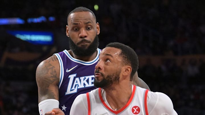 Portland Trail Blazers forward Norman Powell is fouled by Los Angeles Lakers forward LeBron James.