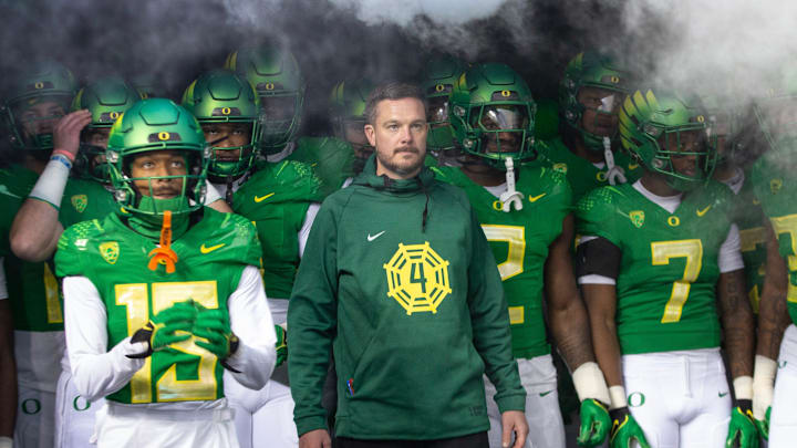 Oregon head coach Dan Lanning, center, waits to take the field with his team for their game against Oregon State at Autzen Stadium Friday, Nov. 24, 2023.