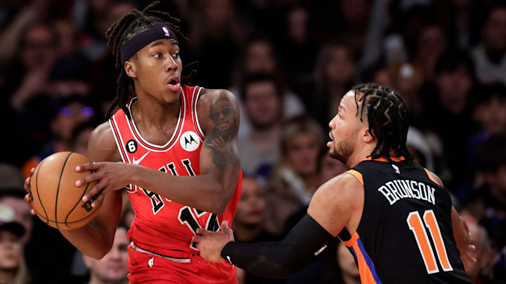 Chicago Bulls guard Ayo Dosunmu is guarded by Jalen Brunson during a game against the New York Knicks.