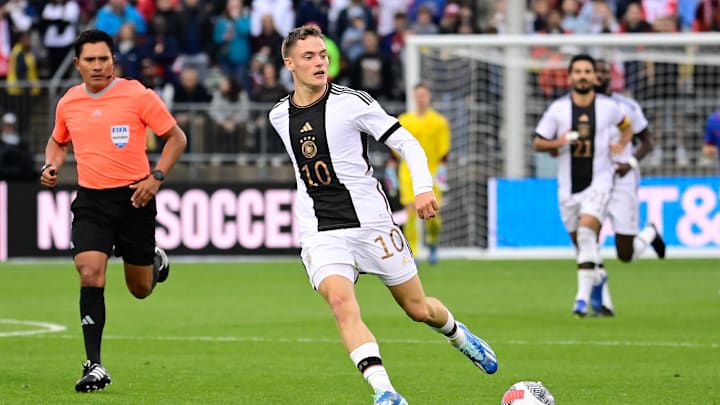 Oct 14, 2023; East Hartford, Connecticut, USA; Germany midfielder Florian Wirtz (10) passes the ball against the United States men's national team during the first half at Pratt & Whitney Stadium. Mandatory Credit: Eric Canha-Imagn Images