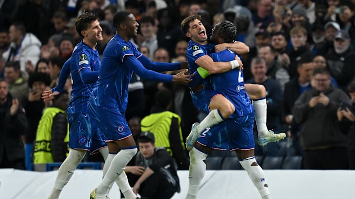 Pedro Neto (centre right) celebrates scoring Chelsea's second goal against Gent with Axel Disasi (right).