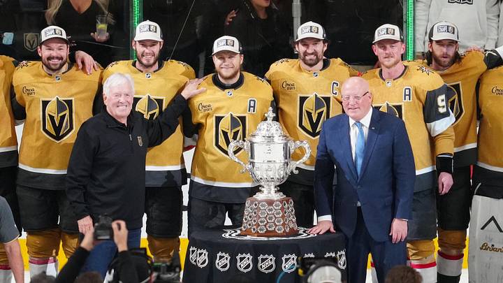 May 26, 2026; Las Vegas, Nevada, USA; Vegas Golden Knights and primary owner of the Vegas Golden Knights Bill Foley are presented with the Clarence S. Campbell Bowl by Deputy commissioner of the NHL Bill Daly after winning against the Colorado Avalanchein game four of the Western Conference Final of the 2026 Stanley Cup Playoffs at T-Mobile Arena. Mandatory Credit: Stephen R. Sylvanie-Imagn Images