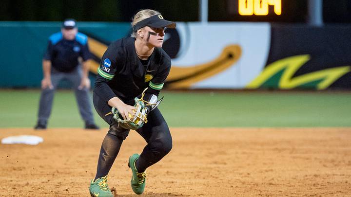 Oregon infielder Paige Sinicki fields the ball as the Oregon Ducks host the Liberty Flames in game one of an NCAA Super Regional at Jane Sanders Stadium in Eugene on May 23, 2025. Oregon infielder Paige Sinicki fields the ball as the Oregon Ducks host the Liberty Flames in game one of an NCAA Super Regional at Jane Sanders Stadium in Eugene on May 23, 2025.