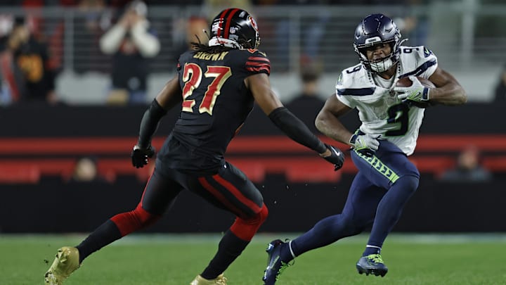 Jan 3, 2026; Santa Clara, California, USA; Seattle Seahawks running back Kenneth Walker III (9) rushes the ball against San Francisco 49ers safety Ji'ayir Brown (27) during the second half at Levi's Stadium. Mandatory Credit: Sergio Estrada-Imagn Images