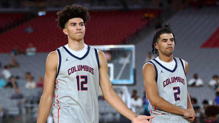  Columbus player Cameron Boozer (12) and brother Cayden Boozer (2) during the Section 7 high school boys tournament at State Farm Stadium. 