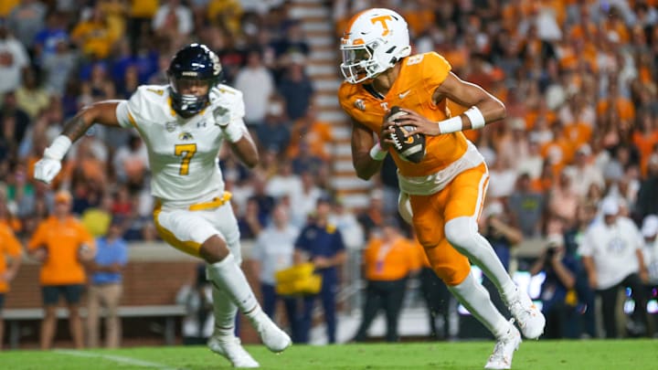 Sep 14, 2024; Knoxville, Tennessee, USA; Tennessee Volunteers quarterback Nico Iamaleava (8) runs the ball against Kent State Golden Flashes linebacker Matt Harmon (7) at Neyland Stadium.