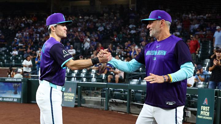 Aug 7, 2026; Phoenix, Arizona, USA; Arizona Diamondbacks outfielder Corbin Carroll (left) with manager Torey Lovullo as he is honored for becoming the all time franchise leader for triples prior to the game against the Los Angeles Dodgers at Chase Field. Mandatory Credit: Mark J. Rebilas-Imagn Images Aug 7, 2026; Phoenix, Arizona, USA; Arizona Diamondbacks outfielder Corbin Carroll (left) with manager Torey Lovullo as he is honored for becoming the all time franchise leader for triples prior to the game against the Los Angeles Dodgers at Chase Field. Mandatory Credit: Mark J. Rebilas-Imagn Images