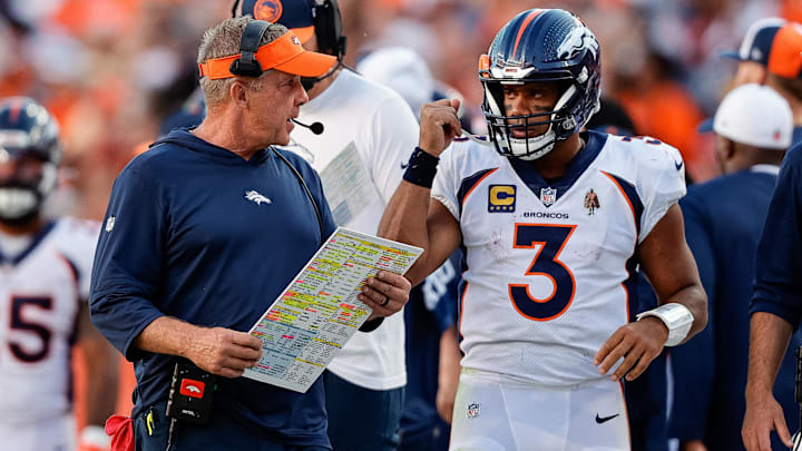 Sep 17, 2023; Denver, Colorado, USA; Denver Broncos head coach Sean Payton talks with quarterback Russell Wilson (3) in the fourth quarter against the Washington Commanders at Empower Field at Mile High.