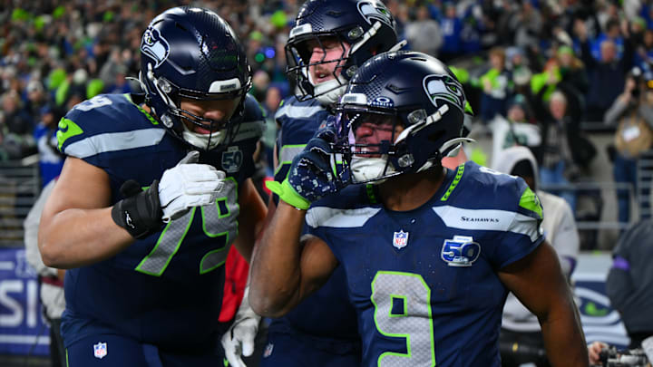 Jan 17, 2026; Seattle, WA, USA; Seattle Seahawks running back Kenneth Walker III (9) reacts with teammates after scoring a touchdown against the San Francisco 49ers during the second half in an NFC Divisional Round game at Lumen Field. 