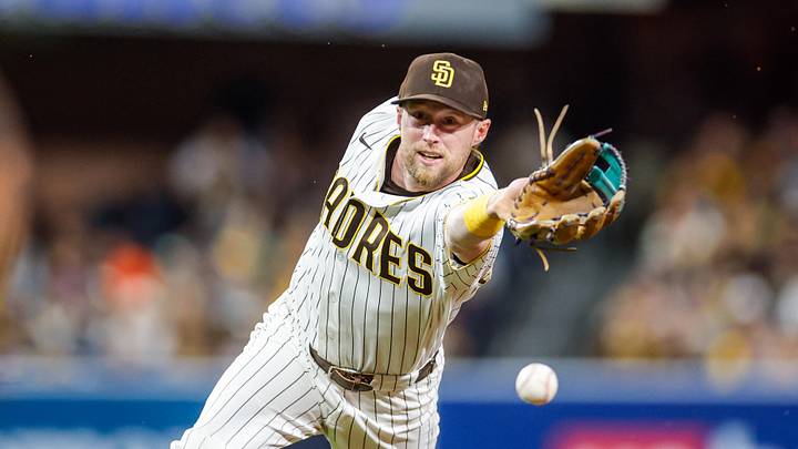 Apr 16, 2026; San Diego, California, USA; San Diego Padres second baseman Jake Cronenworth (9) tosses the ball to first base during the seventh inning against the Seattle Mariners at Petco Park. Mandatory Credit: David Frerker-Imagn Images