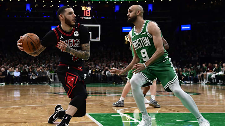 Jan 29, 2025; Boston, Massachusetts, USA; Chicago Bulls guard Lonzo Ball (2) controls the ball while Boston Celtics guard Derrick White (9) defends during the second half at TD Garden. Mandatory Credit: Bob DeChiara-Imagn Images
